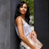 A yong girl holding personalized microsoft surface laptop case with Marble design